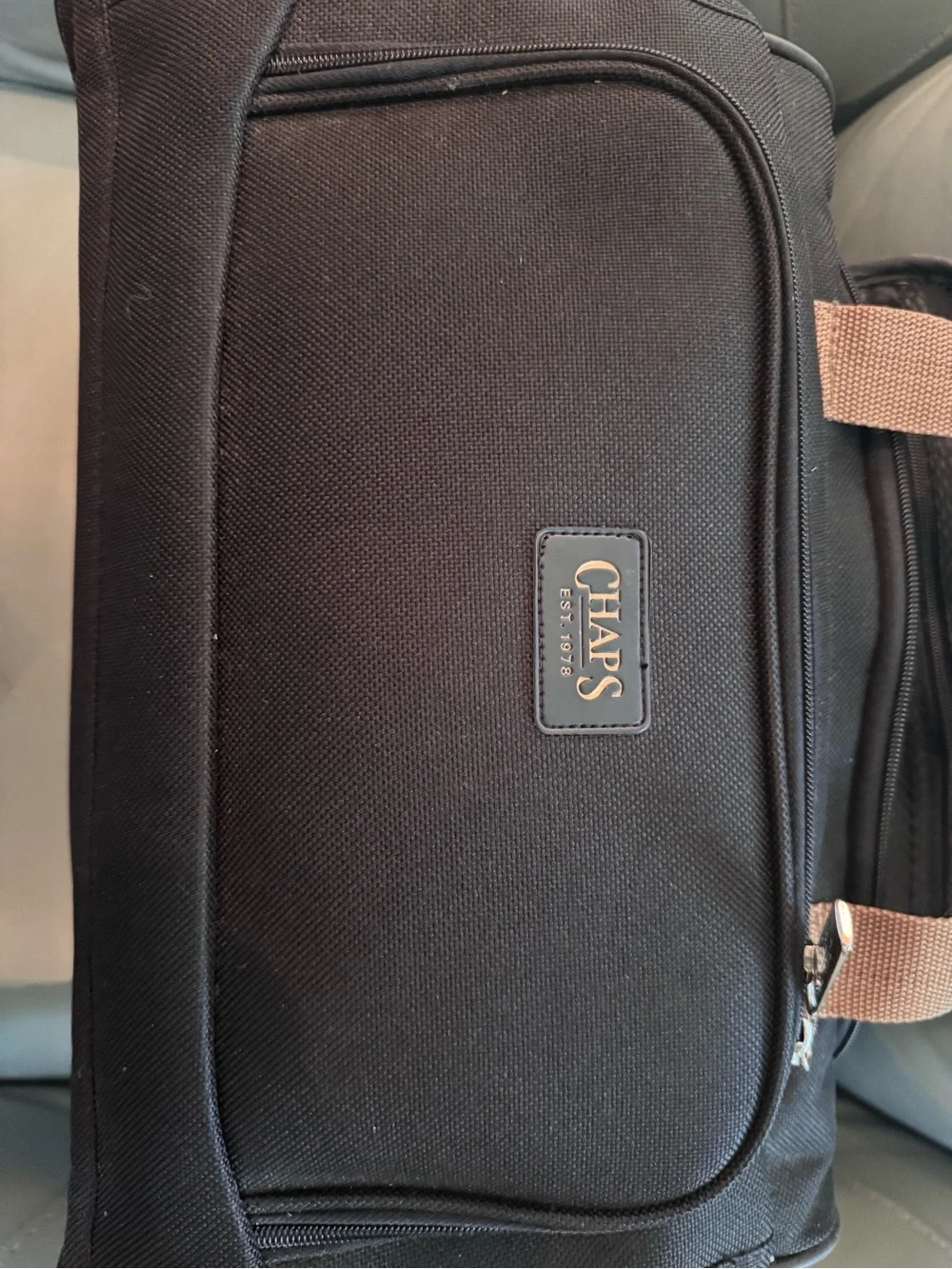Chaps Black Duffel Bag with Tan Trim shoulder strap and double handle